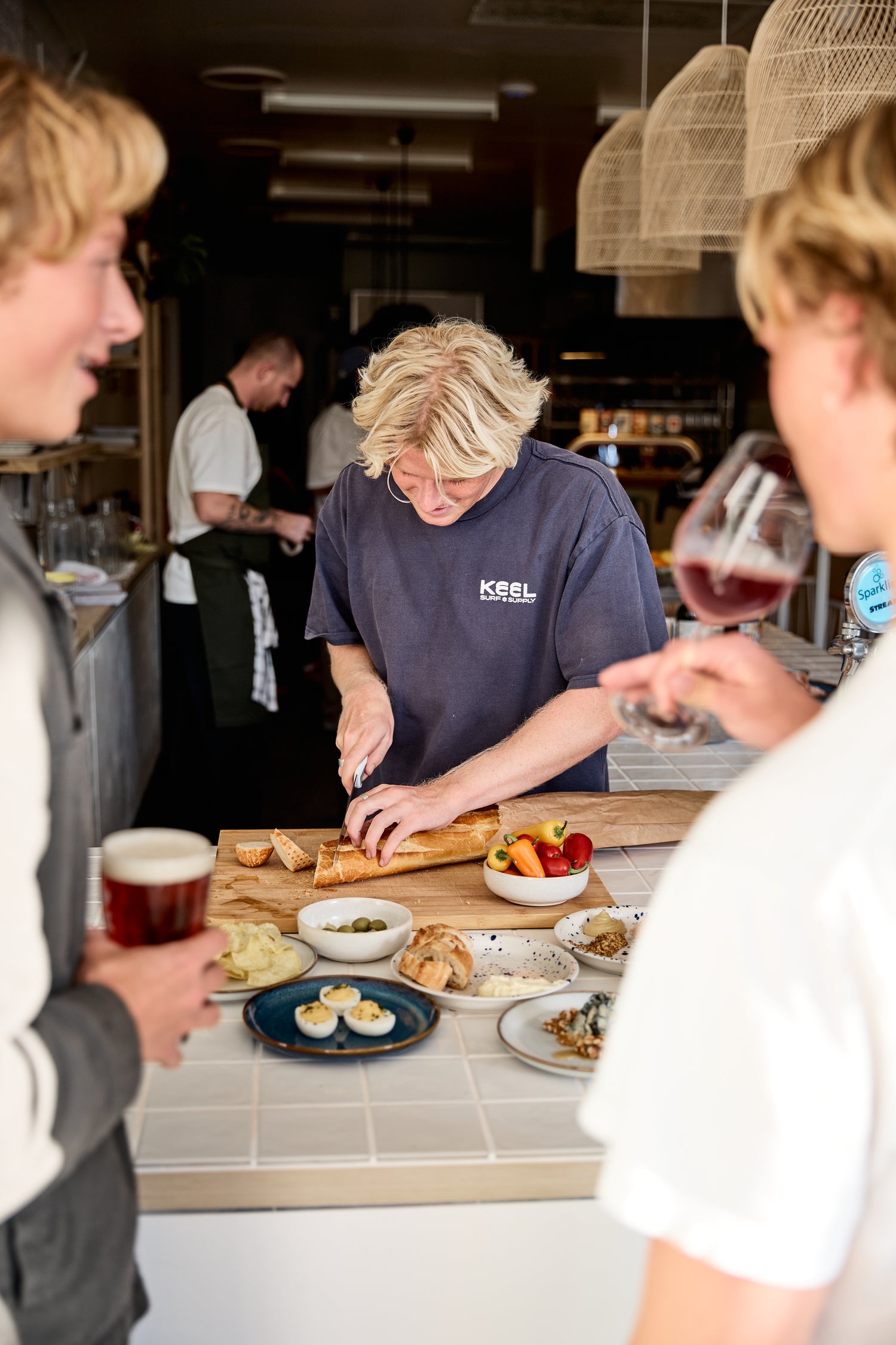 Freshwater Brewing staff preparing food  at Freshie Locale in Freshwater Village