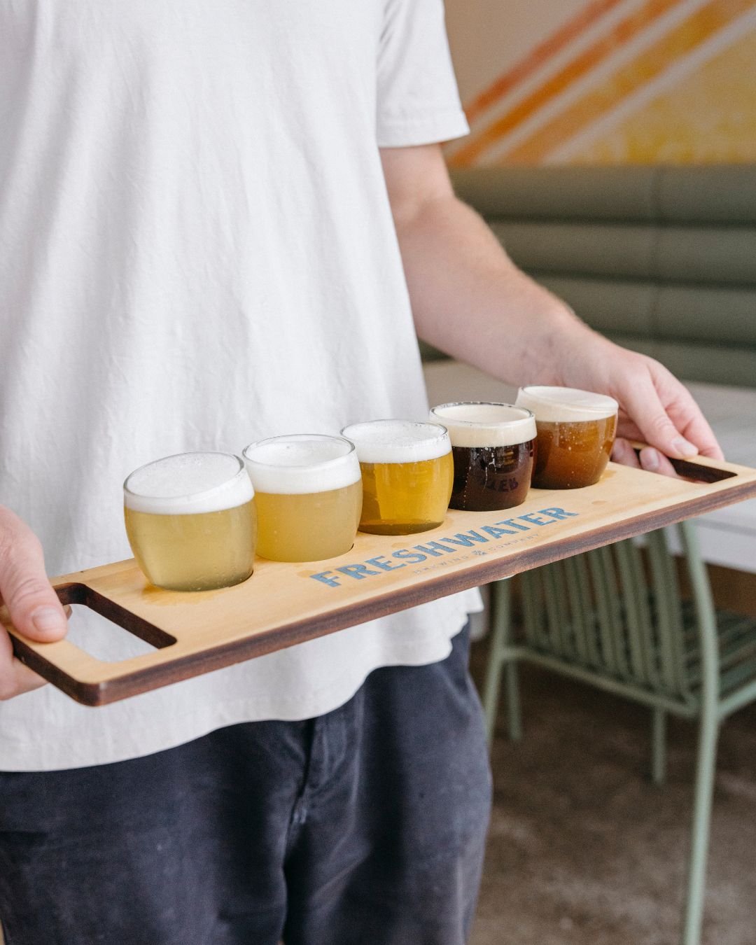 Craft beer tasting paddle at Freshwater Brewing taproom